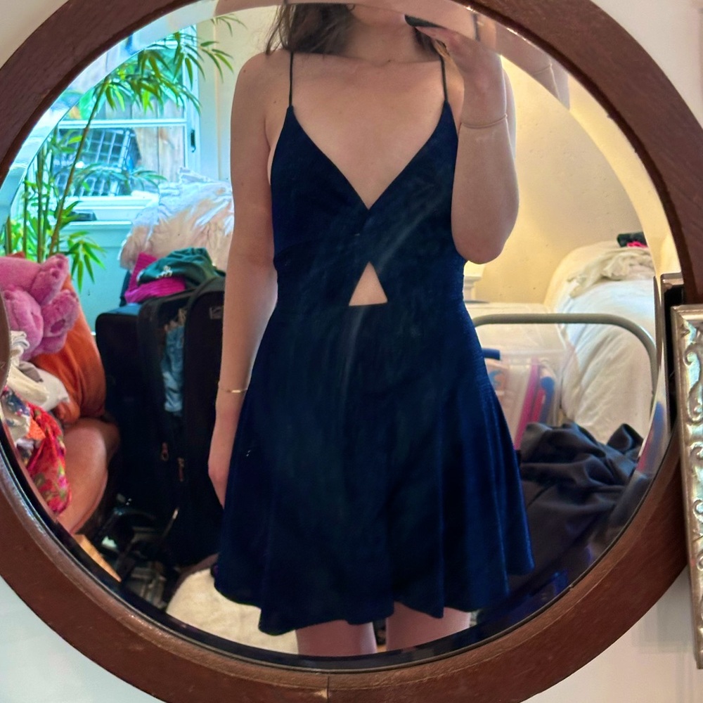Sparkly navy blue Lucy in the Sky dress with a front twist